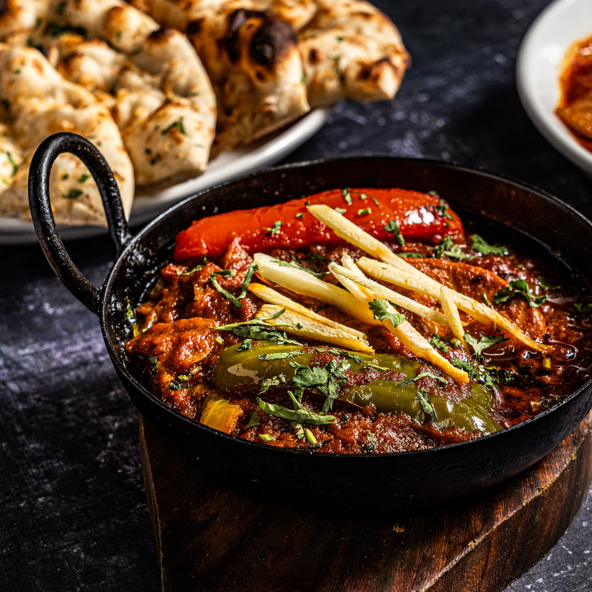 Karahi curry finished with ginger and fresh coriander