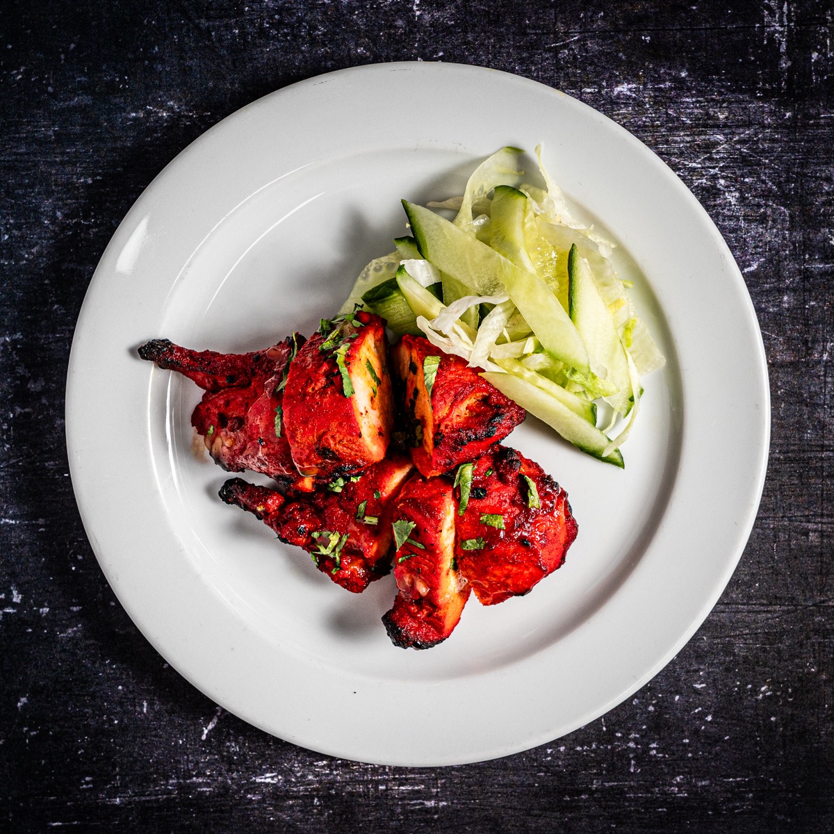 Tandoori chicken served with a crisp fresh salad